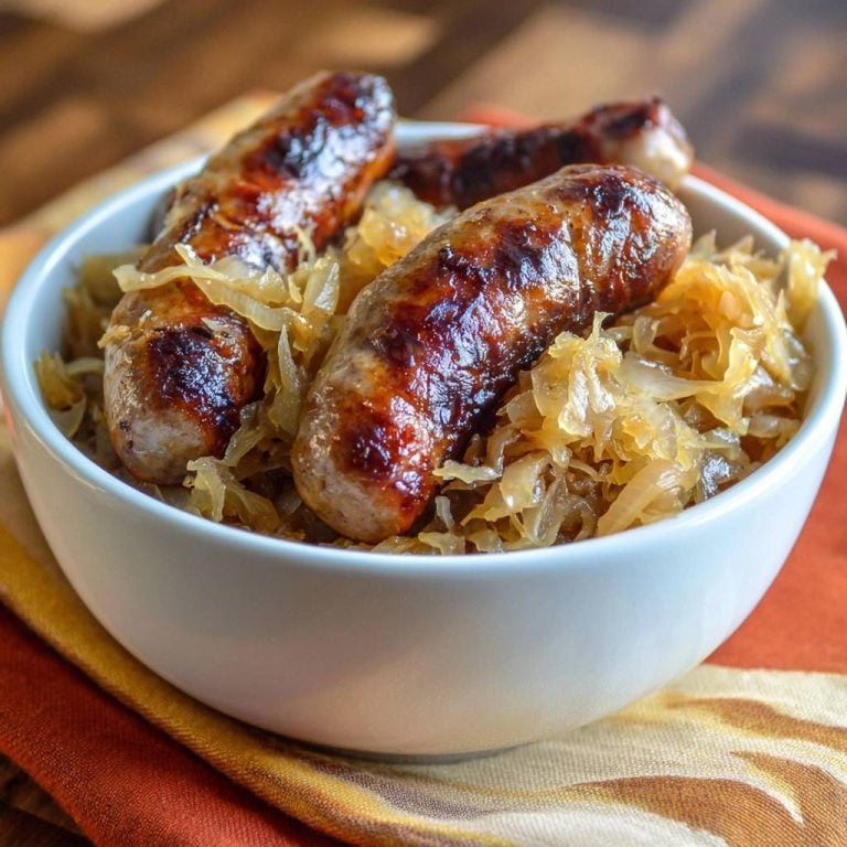 Bratwurst and Sauerkraut: Juicy Sausages Braised in Kraut
